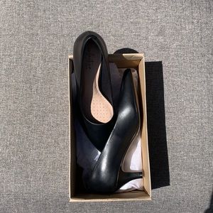 Women’s black pumps.